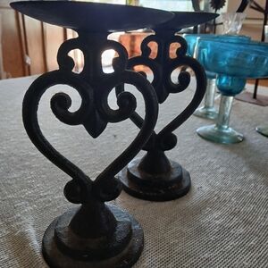 Set of two iron candle holders